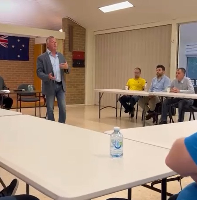 Ryan Smith MP standing and speaking to Jeeran members seated at tables in the Doncaster Senior Citizens Centre, November 2022.